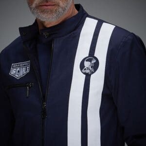 Man in blue jacket with white stripes.